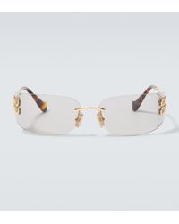 Miu Miu - Logo Oval Sunglasses - Lyst