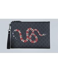 gucci bee print gg supreme pouch