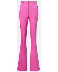 Versace - Embellished High-Rise Wool Flared Pants - Lyst