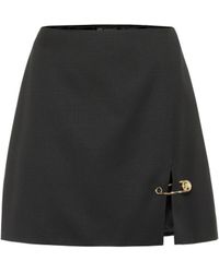Versace Mini-jupe en laine à taille haute - Noir