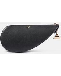 Alaïa - Le Demi Cour Leather Clutch - Lyst