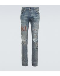 Amiri Distressed Skinny Jeans mit Leder - Blau
