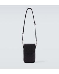 Gucci - Gg Emblem Debossed Leather Phone Pouch - Lyst