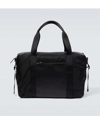 Tod's - Large Leather-trimmed Duffel Bag - Lyst