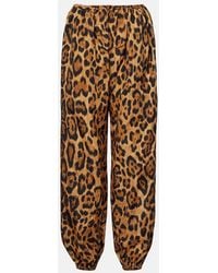 Alaïa - Leopard-Print Tapered Pants - Lyst