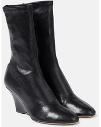 KHAITE - Apollo Wedge Leather Ankle Boots - Lyst