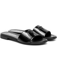 Prada Pantoletten aus Lackleder - Schwarz