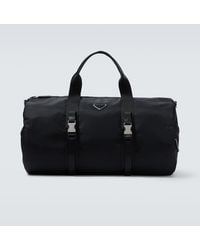 Prada - Re-Nylon Leather-Trimmed Duffel Bag - Lyst