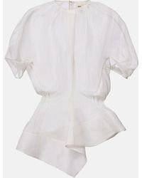 KHAITE - Rumi Sheer Peplum Silk Top - Lyst
