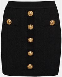 Balmain - Falda mini negra con botones tejida - Lyst