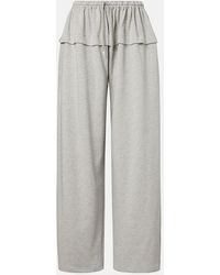 Alaïa - Ruffled Cotton-Blend Track Pants - Lyst