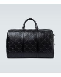 Gucci GG Embossed Duffle Bag - Black