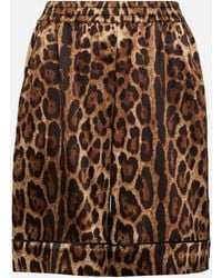 Dolce & Gabbana - Mini-jupe en soie melangee a motif leopard - Lyst