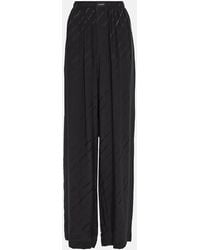 Balenciaga - Pantaloni in seta a vita alta con logo - Lyst