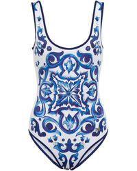 Costume intero a balconcino stampa maiolicaDolce & Gabbana in Materiale sintetico di colore Blu Donna Abbigliamento da Abbigliamento da spiaggia 