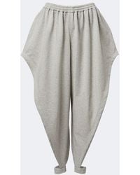 Alaïa - Ruffled Cotton-Blend Fleece Tapered Pants - Lyst