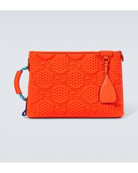 Gucci - Large Embossed GG Leather-trimmed Pouch - Lyst