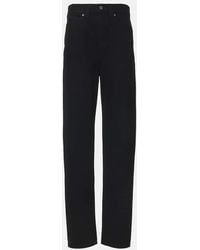 KHAITE - Jeans Tapered Corben A Vita Alta - Lyst