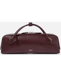 Alaïa - Le Teckel Leather Clutch - Lyst
