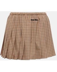 Miu Miu - Minifalda de algodon plisada con logo - Lyst