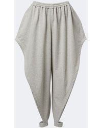 Alaïa - Ruffled Cotton-Blend Fleece Tapered Pants - Lyst