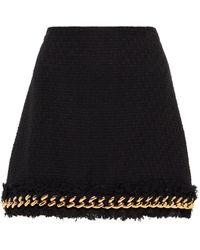 Versace Minifalda de tweed adornada con cadenas - Negro