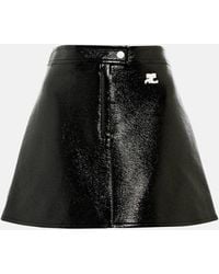 Courreges - Mini-jupe en cuir synthetique a logo - Lyst