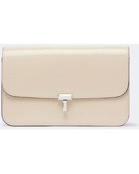 TOTEME - T-Lock Patent Leather Crossbody Bag - Lyst