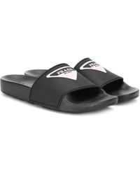 Prada Chinelas de caucho con logo - Negro