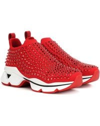 red sneakers with spikes