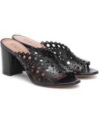 Alaïa Mules Fleur aus Leder und PVC in Schwarz Damen Schuhe Absätze Clogs 