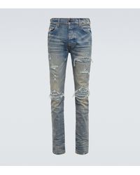 Amiri Jeans skinny con rotos - Azul