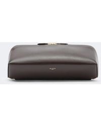 Alaïa - Delta Small Leather Clutch - Lyst