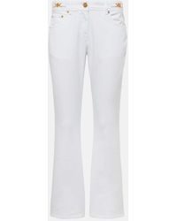 Versace - Embellished Low-rise Flared Jeans - Lyst