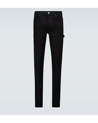 Amiri Skinny-Jeans MX1 mit Ledereinsätzen - Schwarz