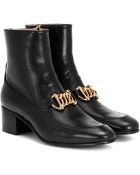 gucci boots with snakes on the bottom