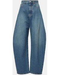 Alaïa - High-Rise Barrel-Leg Jeans - Lyst
