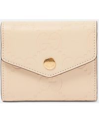 Gucci - Medium GG Debossed Leather Wallet - Lyst