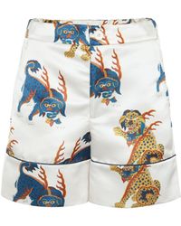 Femme Vêtements Shorts Mini shorts Pantalon imprimé en satin Kirin en coloris Bleu 