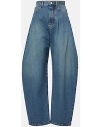 Alaïa - High-Rise Barrel-Leg Jeans - Lyst