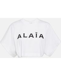 Alaïa - T-shirt cropped in cotone con logo - Lyst
