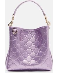Gucci - Gg Emblem Medium Metallic Leather Bucket Bag - Lyst