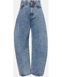 Alaïa - High-Rise Barrel-Leg Jeans - Lyst