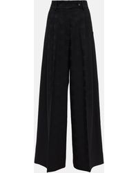 Dolce & Gabbana - Pantalon ample en laine melangee a logo - Lyst