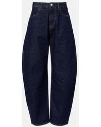 Alaïa - Mid-Rise Barrel-Leg Jeans - Lyst