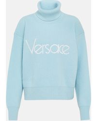 Versace - Pull a col roule a logo - Lyst