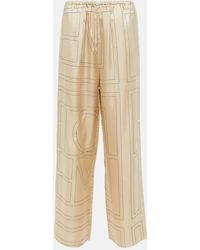 Totême - Pantalones de seda de tiro medio con logo - Lyst