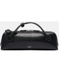 Alaïa - Le Teckel Small Leather Clutch - Lyst