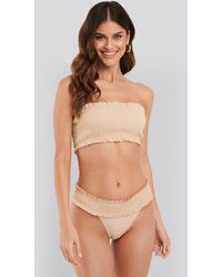 NA-KD Swimwear Smocked Flounce Bandeau Top - Natur