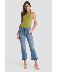 NA-KD Undone Hem Kick Flare Jeans - Blauw